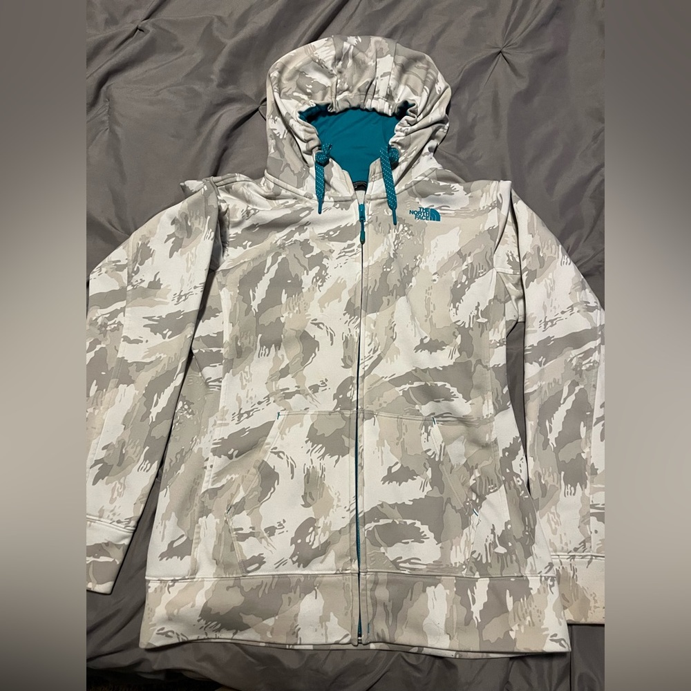 The North Face Full Zip Gray/white camo with teal blue detailing.